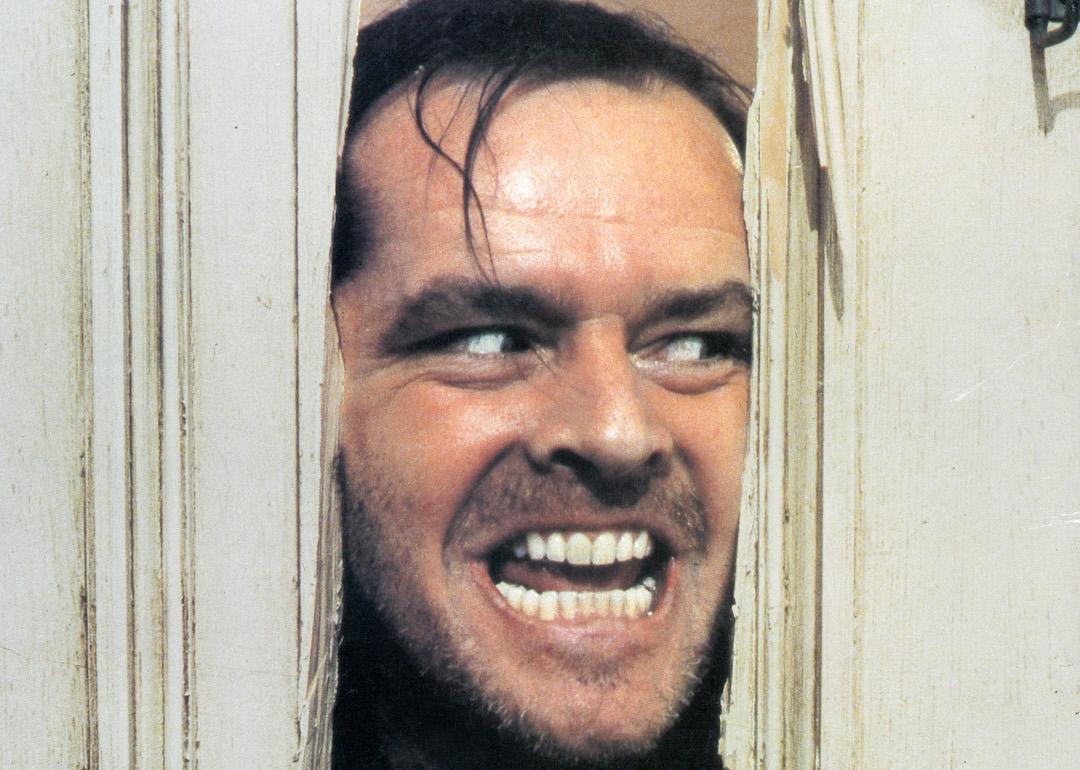 Actor Jack Nicholson peering through an axed in door in the famous 'Here's Johnny' scene in the 1980 horror film 'The Shining.'