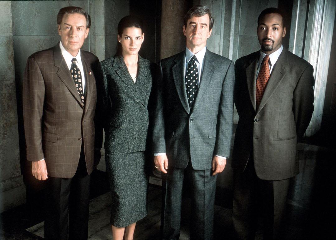 Actors Jerry Orbach, Angie Harmon, Sam Waterston, and Jesse L. Martin pose in costume as their 'Law & Order' characters in 1999.