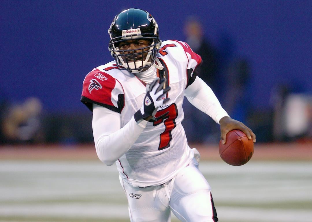 Michael Vick #7 of the Atlanta Falcons runs with the ball against the New York Giants.
