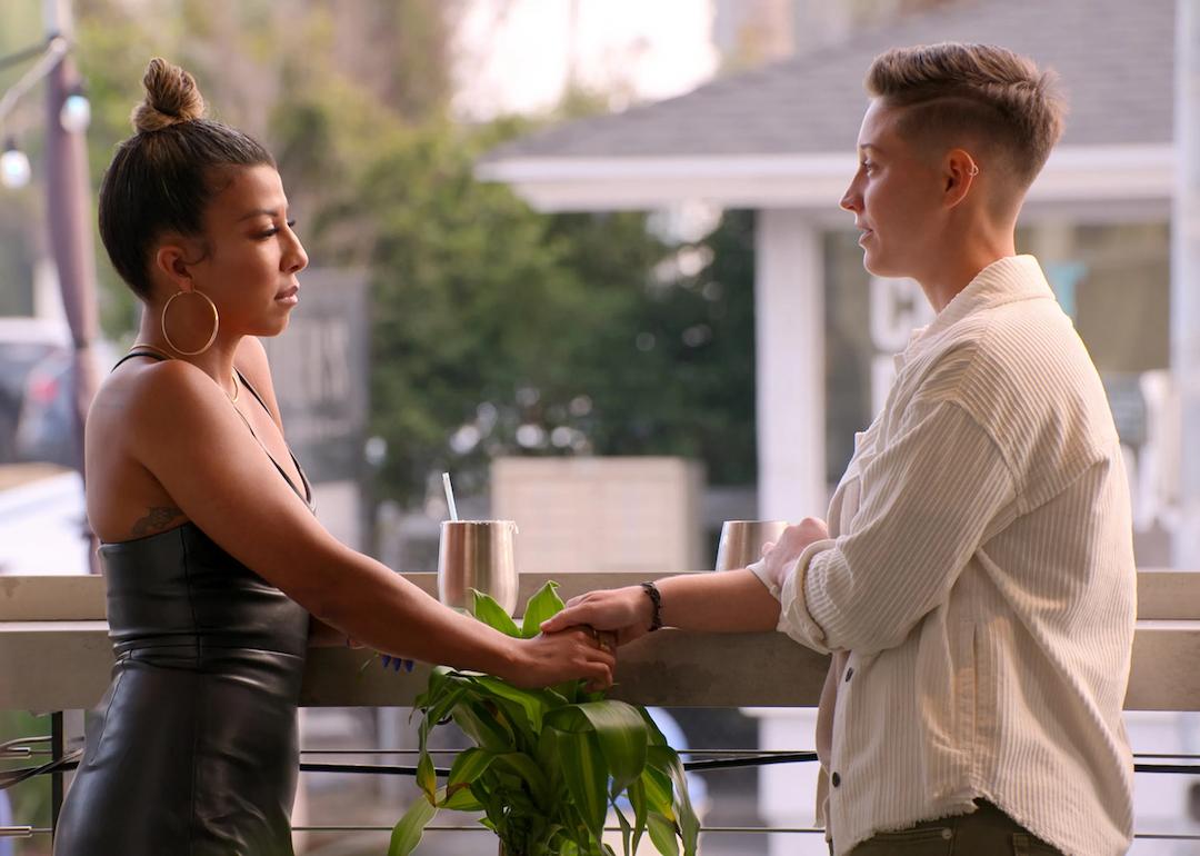 Yoly and Xander hold hands on the Netflix dating show 'The Ultimatum: Queer Love.'