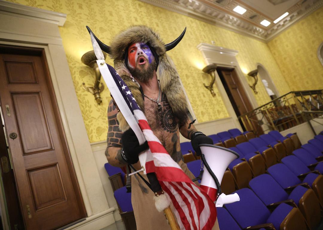 A protester inside the Senate chamber after the U.S. Capitol was breached by a mob during a joint session of Congress on Jan. 6, 2021 in Washington, D.C.
