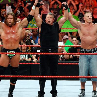 Wrestler Triple H, World Wrestling Entertainment Inc. Chairman Vince McMahon, and wrestler John Cena pose in the ring during the WWE Monday Night Raw show at the Thomas & Mack Center on Aug. 24, 2009 in Las Vegas, Nevada.