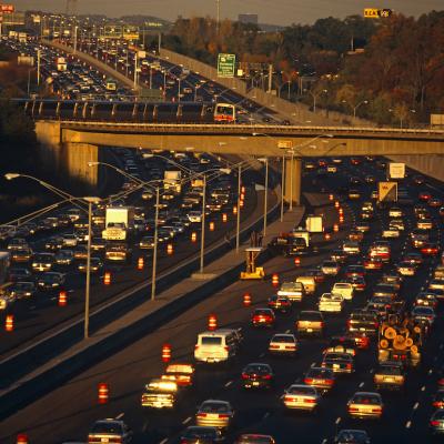 Near the junction of the 400 to Buckhead, the 401 highway divides and splits during afternoon rush-hour traffic which slows and builds up so that vehicles and cars back-up as they head home and out of Downtown Atlanta, Georgia.