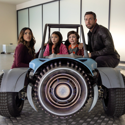 Actors Gina Rodriguez and Zachary Levi, along with new Spy Kids actors Connor Esterson and Everly Carganilla in a scene from "Spy Kids: Armageddon"