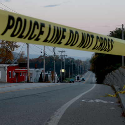 Police line tape in Lewiston, Maine. Law Enforcement officials continue their investigation at the Schemengees Bar where one of two mass shootings took place on October 27, 2023 in Lewiston, Maine.