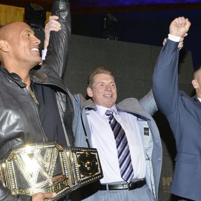 Wrestler Dwayne 'The Rock' Johnson, World Wrestling Entertainment Inc. Chairman Vince McMahon, and wrestler John Cena attend the WrestleMania 29 Press Conference at Radio City Music Hall in New York City.