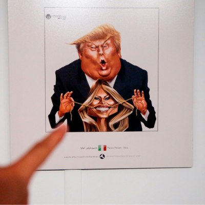 A picture taken on July 3, 2017 shows a cartoon of US President Donald J. Trump and First Lady Melania Trump on display at an exhibition of the Islamic Republic's 2017 International Trumpism cartoon and caricature contest, in the capital Tehran.