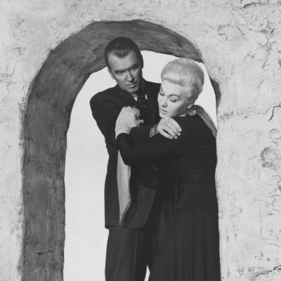 Movie still from the 1958 Alfred Hitchcock thriller, "Vertigo" In this, the climactic belltower scene, James Stewart and Kim Novak are standing under a stone archway as he plots to push her.