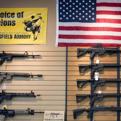 Assault rifles hang on the wall for sale at Blue Ridge Arsenal in Chantilly, Virginia, on Oct. 6, 2017.