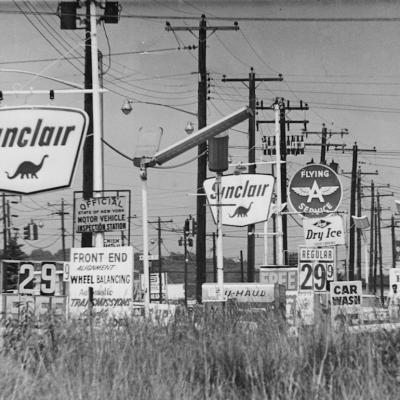 Gas station and oil company signs clutter Hempstead Turnpike in Farmingdale, New York on July 8, 1968.