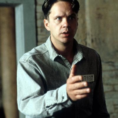 Actor Tim Robbins extends his hand in a scene from the 1994 film 'The Shawshank Redemption.'