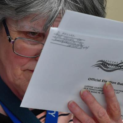 Luzerne County official checks ballots on election night in 2023