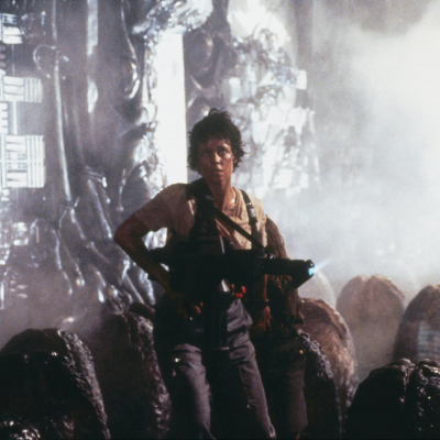 American actor Sigourney Weaver on the set of the film Aliens, directed by James Cameron. 