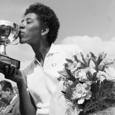 Althea Gibson kisses the cup she was awardedafter winning the French International Tennis Championships in Paris in 1956.