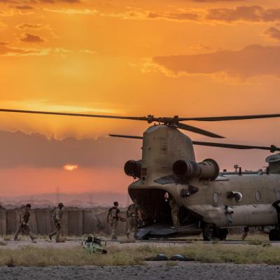 U.S. Army soldiers board a CH-47 Chinook helicopter while departing a remote combat outpost known as RLZ on May 25, 2021 near the Turkish border in northeastern Syria.