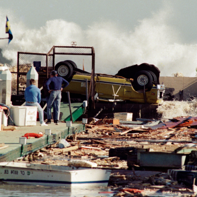 Heavy rains and winds caused moderate damage by overturning vehicles, damaging piers with waves breaking over the rock jetty, January 17, 1988 in Redondo Beach, California.