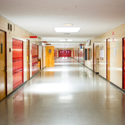 empty school hallway lined with lockers