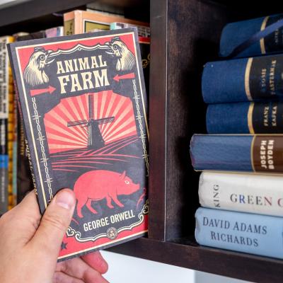 George Orwell's 'Animal Farm' is pulled from a bookshelf.