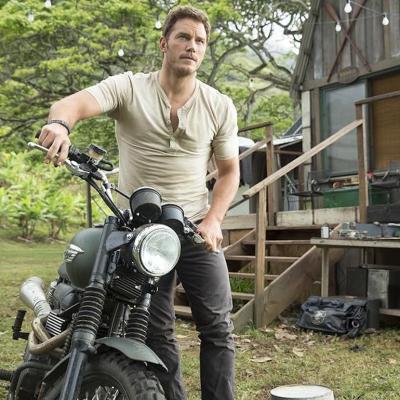 Actor Chris Pratt on a motorcycle in the 2015 movie 'Jurassic World.'