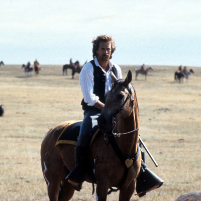 Kevin Costner riding a horse on a wide open plain in a scene from the film 'Dances With Wolves', 1990.