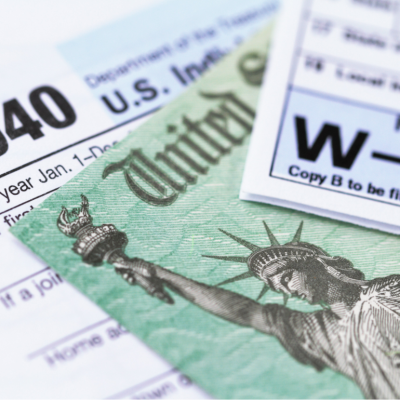 1040 and W-2 tax forms, with U.S. treasury check