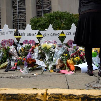 Mourners visit the memorial outside the Tree of Life Synagogue on Oct. 31, 2018 in Pittsburgh, Pennsylvania.