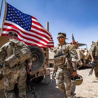 U.S. Army soldiers patrol the countryside of Rumaylan (Rmeilan) in Syria's northeastern Hasakeh province on June 7, 2023.