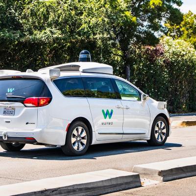 Waymo self driving car performing tests on a street 