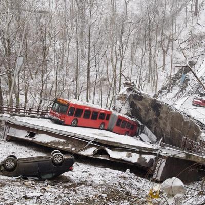 Bus and flipped car visible on Fern Hollow Bridge collapse near Pittsburgh, PA