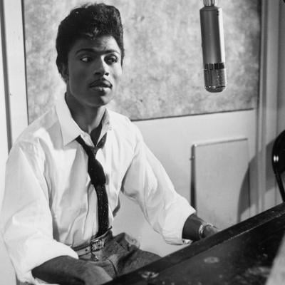 Musician Little Richard in the recording studio at a microphone and piano in circa 1959.