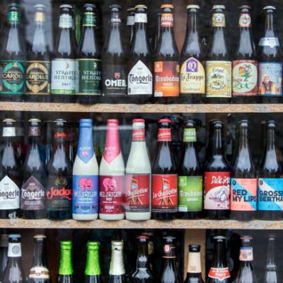 An assortment of beer bottles on a store shelf