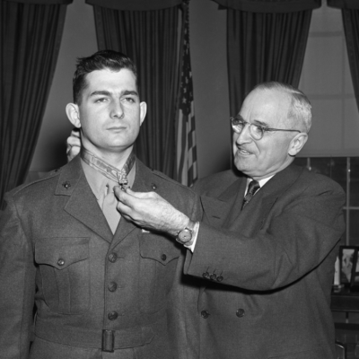 President Truman presents the Medal of Honor to Marine Sgt. Archie Van Winkle of Everett, Washington.