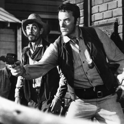 Actors James Arness and Ken Curtis in street scene of 'Gunsmoke.'
