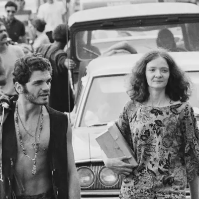 Fans waiting outside their car on the way to the Woodstock Music Festival