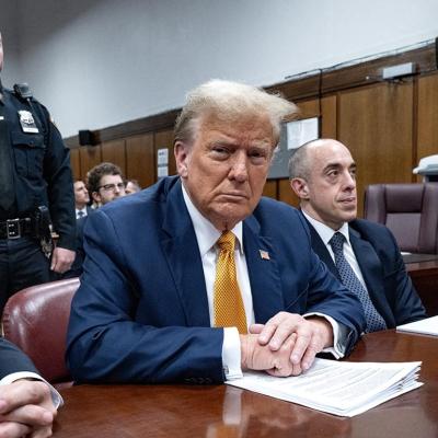 Former US President Donald Trump, center, attends his trial for allegedly covering up hush money payments linked to extramarital affairs, at Manhattan Criminal Court in New York City, on May 14, 2024. 