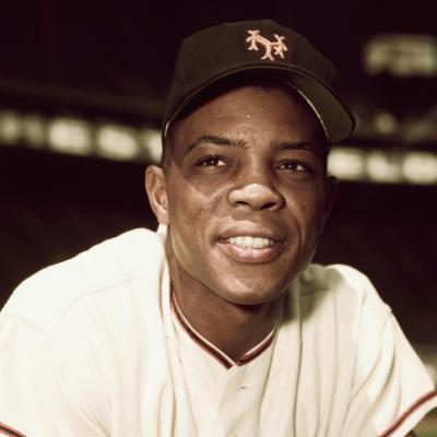 Willie Mays of the New York Giants is shown here in this three-quarters length photo on one knee. 