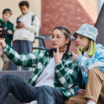 Two teenagers posing for a selfie