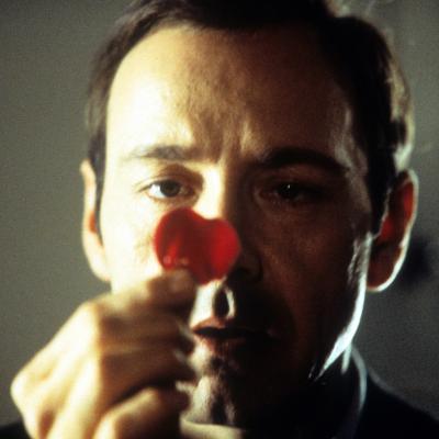 Kevin Spacey staring at a rose pedal in a scene from the 1999 film 'American Beauty.' 