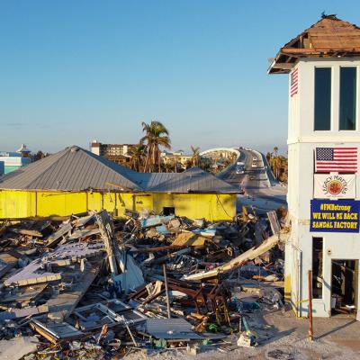 In November 2022, a month after Hurricane Ian hit FL, Fort Myers Beach still had piles of rubble alongshore.