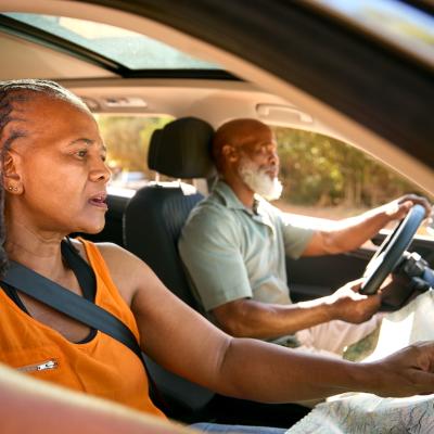 Confused senior couple lost while driving.