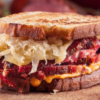 Reuben Sandwich with corned beef, cheese, and sauerkraut.