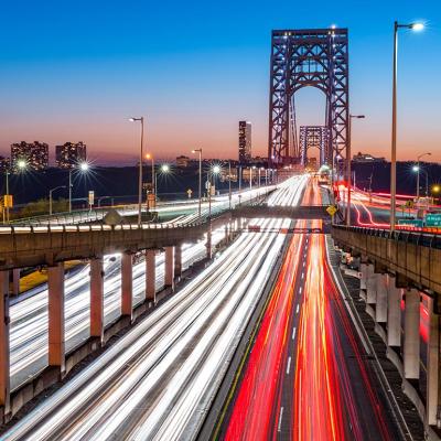 Rush hour traffic with light trails on George Washington Bridge, in New York City.