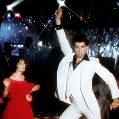 Actor John Travolta dances with Karen Lynn Gorney in scene from movie "Saturday Night Fever" directed by John Badham.