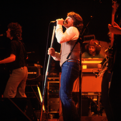 American Rock and Pop singer Bobby Kimball, of the group Toto, performs onstage at the Park West, Chicago, Illinois, August 2, 1985. Also visible is bandmate Steve Lukather (left) on guitar.