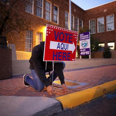 Pollworkers put out signs in El Paso, TX for the midterm election in 2018. 