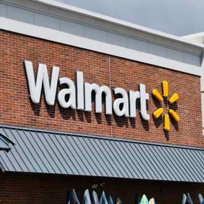 Exterior view of a Walmart store, with the logo against a brick wall 