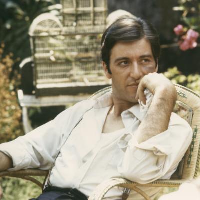 Al Pacino relaxes in garden as Michael Corleone in a scene from the 1972 drama 'The Godfather.' 