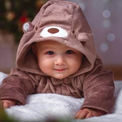 Happy infant in baby bear robe.