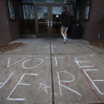 A person enters a polling location on the Michigan State University campus on Election Day.