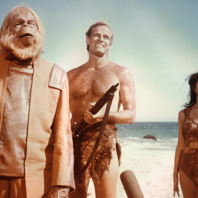 Actors Charlton Heston, Linda Harrison, and Maurice Evans in the 1968 sci-fi film 'Planet of the Apes.'